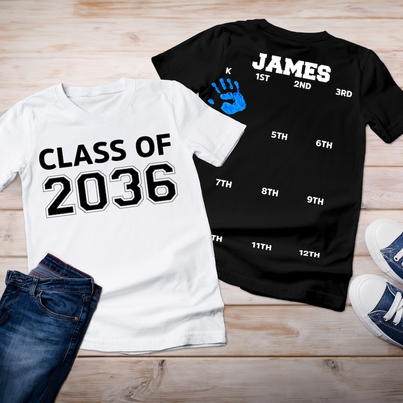 May include: Two white t-shirts with black text. One shirt says "CLASS OF 2036" and the other shirt says "JAMES" with a handprint and numbers 1st through 12th.