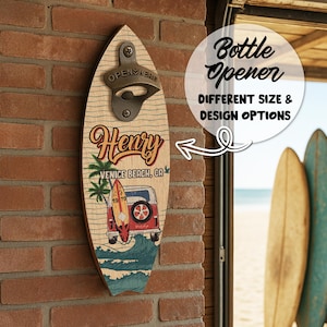 May include: Wooden surfboard-shaped bottle opener with a metal opener. The design features a vintage van, surfboard, palm trees, and the text "Henry Venice Beach, CA 1970". It is mounted on a brick wall.