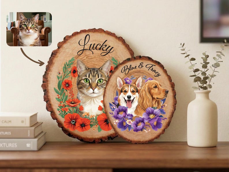 May include: Two wooden plaques with pet portraits. One features a cat with the word "Lucky" above it, surrounded by red poppies. The other has a Corgi and Cocker Spaniel with the text "Blue & Tracy" and purple flowers.