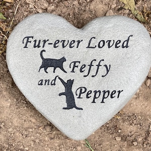 Heart shaped pet memorial stone with cats.
