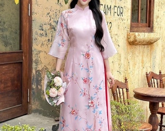 Ao dai women with flower and butterfly embellishments - Vietnamese traditional dress