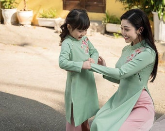 Women and kid matching Ao dai- Vietnamese traditional dress