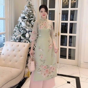 Ao dai women with flower and butterfly embellishments - Vietnamese traditional dress