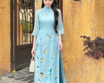 Ao dai women with flower and butterfly embellishments - Vietnamese traditional dress