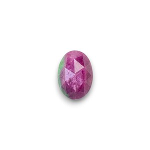 May include: An oval-shaped gemstone with a faceted surface. The gem features a blend of pink and green hues, with a prominent pink center and a subtle green edge. The gem is set against a white background.
