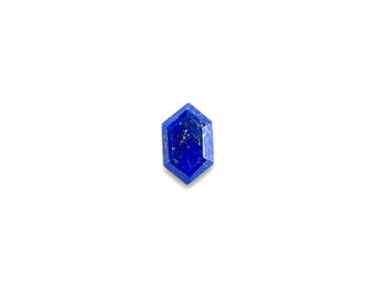 May include: A deep blue, faceted, hexagonal lapis lazuli gemstone with gold flecks.