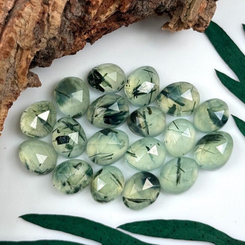Multiple tourmalinated prehnite rose cut cabochon stones.  Gemstone cabochons size 9.5 - 11 mm.
