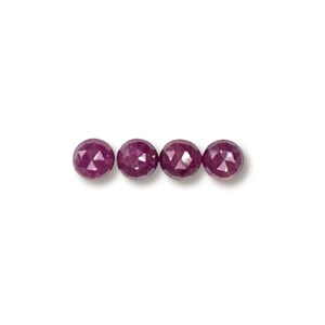 May include: Four round, faceted ruby beads in a row. The beads are a deep, rich red color.