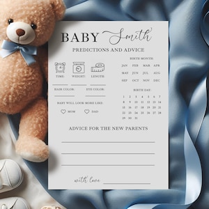 May include: A light gray baby shower prediction and advice card with the text "BABY Smith". The card includes sections for predictions about the baby's birth, including time, weight, and length, and advice for parents. A teddy bear and baby shoes are in the background.
