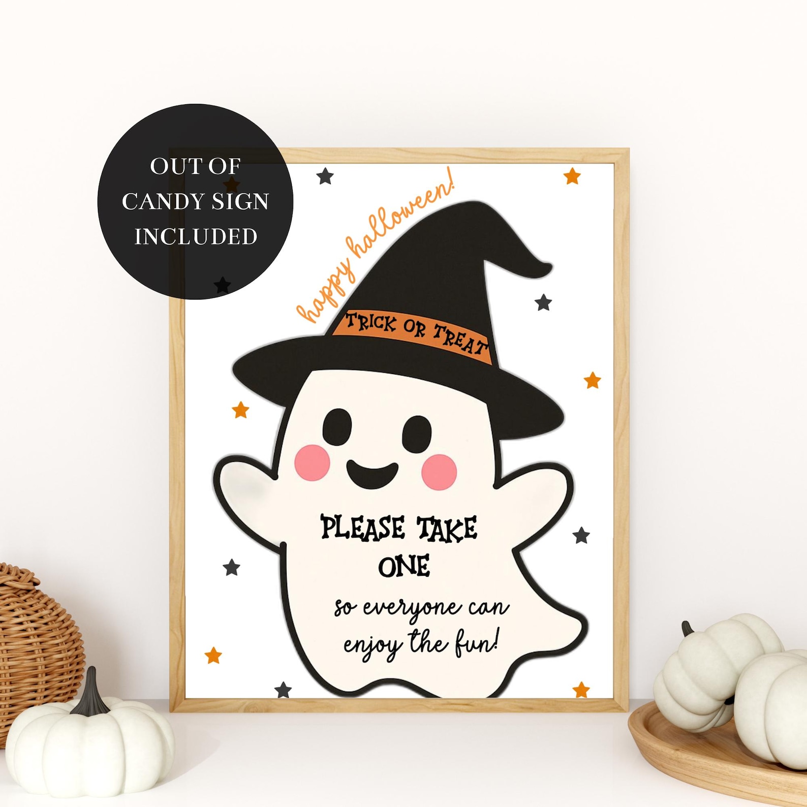 A Ghost in a Witch Hat Cream Halloween candy sign with a ghost wearing a pointed black hat.