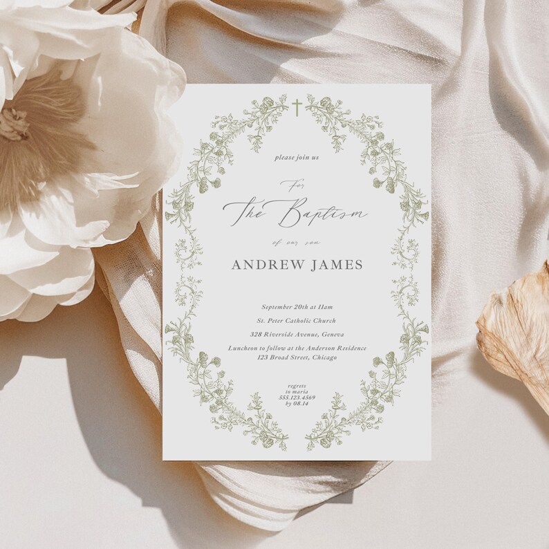 May include: A baptism invitation card featuring a floral wreath and elegant script. The card displays the name "Andrew James", date, time, and location details. The background is neutral with a soft, blurred floral element.