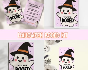 May include: A Halloween-themed kit featuring a cartoon ghost wearing a witch hat. The ghost has a smiling face and the text "You've Been Booed" or "We've Been Booed". The kit includes instructions and decorative elements.