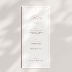 May include: A rectangular menu card with a decorative border and a cross at the top. The menu includes the text "Menu", "Eloise's Baptism", and a list of dishes such as "Buffalo Caprese" and "Tiramisu". The color scheme is a soft, muted palette.