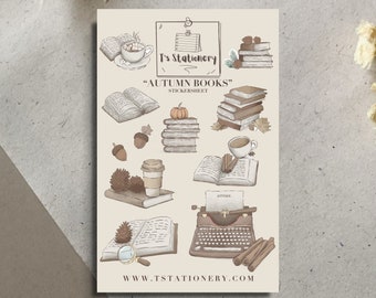 May include: A sticker sheet with an autumn theme featuring illustrations of books, coffee, a typewriter, acorns, and cinnamon sticks. The sticker sheet is titled "Autumn Books" and includes the website "www.tstationery.com".