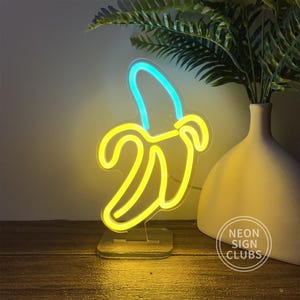 Insegna luminosa al neon a banana da 9,8 pollici Insegna al neon personalizzata per la decorazione della lampada da camera da letto Insegna al neon per bar Luce notturna Lampada da scrivania Piccola lampada da tavolo