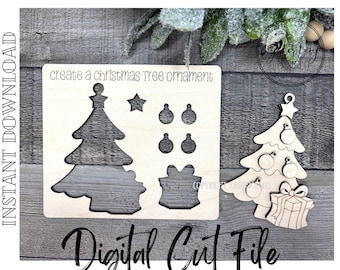 Puede incluir: Archivo de corte digital de adorno de árbol de Navidad de madera. El diseño incluye un árbol de Navidad, una estrella, bolas y una caja de regalo. El texto "create a Christmas Tree ornament" y "Digital Cut File" son visibles.