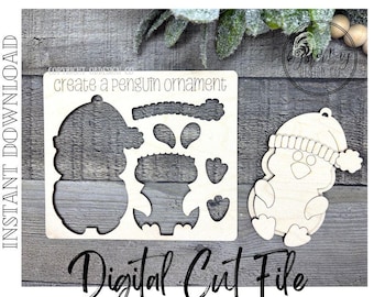 May include: A wooden digital cut file for a penguin ornament. The file includes the pieces to create the penguin, plus a completed penguin ornament. The text "create a penguin ornament" and "Digital Cut File" are visible.
