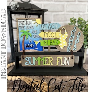 May include: A digital cut file design for a summer themed craft project. The design includes a sign that says "The sun, the sand, and a drink in hand", a sign that says "Beach Pool Tiki Bar", a swimsuit, and a sign that says "Summer Fun".
