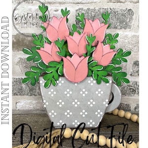 May include: A digital cut file design of a gray ceramic flower pot with pink tulips and green leaves. The text "Digital Cut File" is at the bottom of the image.