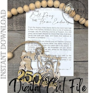 May include: A wooden laser-cut ornament featuring the text "250 YEARS" and illustrations of the Liberty Bell and the Statue of Liberty. The ornament is suspended by a string and is displayed with a printed card. The words "Digital Cut File" are also visible.