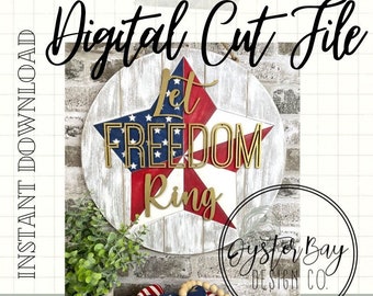 May include: Digital cut file for a wooden sign with a red, white, and blue star and the words "Let Freedom Ring". The sign is distressed and has a whitewashed finish. The text "Oyster Bay Design Co." is also visible in the image.
