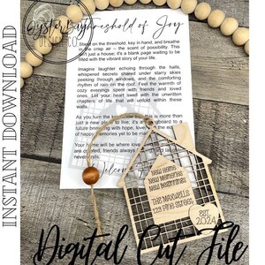 May include: A wooden house-shaped cutout with a decorative heart and the text "New Home, New Memories, New Beginnings" and "The Maxwells, 123 Pine Street, Est. 2024". The cutout is attached to a piece of paper with a handwritten message about the joy of a new home.