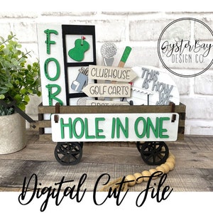 May include: A wooden golf cart with the words "FOR" and "HOLE IN ONE" on it. The cart is decorated with golf-themed cutouts, including a golf club, a golf ball, and a sign that says "Clubhouse Golf Carts".