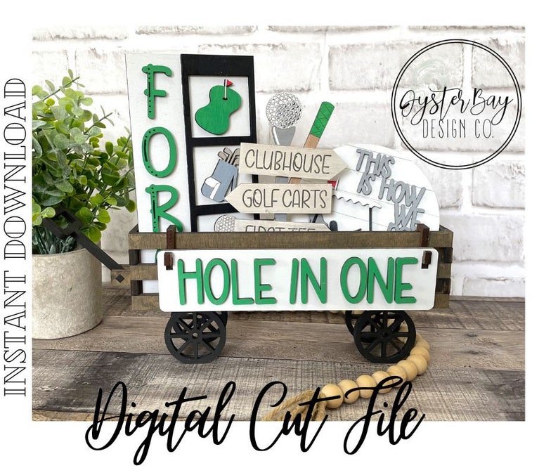 May include: A wooden golf cart with the words "FOR" and "HOLE IN ONE" on it. The cart is decorated with golf-themed cutouts, including a golf club, a golf ball, and a sign that says "Clubhouse Golf Carts".