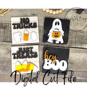 Könnte beinhalten: Vier Holzschildchen mit Halloween-Motiven. Die Schilder zeigen "No Tricks", "Just Treats", "Hey Boo" und einen Geist, der einen Kürbis hält.