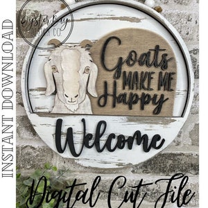 May include: A white wooden round sign with distressed paint and a brown wood background. The sign features a goat head illustration, the text "Goats Make Me Happy" and the word "Welcome".