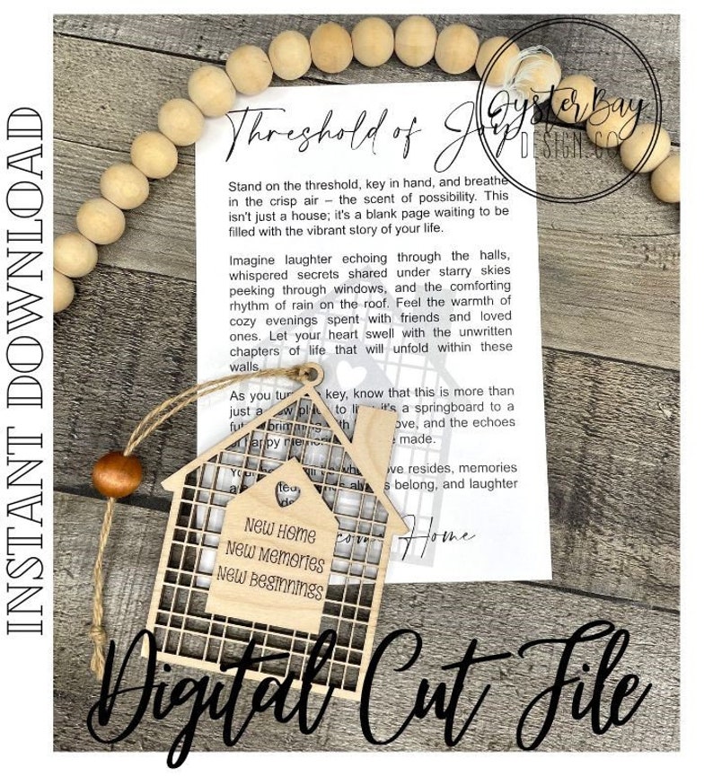 May include: A wooden house-shaped cutout with a lattice design and the text "New Home, New Memories, New Beginnings". The cutout is hanging from a string and is on top of a white piece of paper with text that reads "Threshold of Joy" and a poem about a new home.