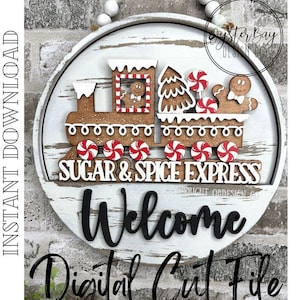 Peut inclure: Panneau rond en bois blanc avec un motif de train en pain d'épices. Le train présente des bonhommes en pain d'épices, des bonbons et les mots "Sugar & Spice Express". En dessous, le panneau dit "Welcome" et "Digital Cut File".
