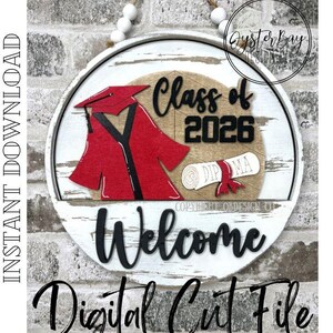May include: A circular wooden sign with a graduation theme. It displays a red graduation cap and gown, the text "Class of 2026", and a diploma. The sign also says "Welcome" and "Digital Cut File".