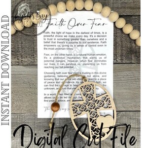 May include: A wooden cutout of a cross with a heart at the bottom. The cutout is surrounded by a circle with a decorative pattern. The cutout is hanging from a string with a wooden bead. The text "Faith Over Fear" is written on a white background with a quote about faith and fear.