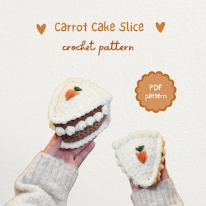 May include: Two crochet carrot cake slices, one held in each hand, with a white frosting and a small orange carrot on top. The text "Carrot Cake Slice crochet pattern" is displayed above the cakes. A PDF pattern icon is also visible.