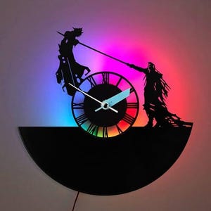 May include: Black silhouette clock featuring two figures in a battle pose, with a clock face in the centre. The clock hands are white and blue. The background has a gradient of colours, including purple, blue, and red.