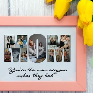 May include: A pink picture frame with a white mount and a collage of photos spelling out the word "MOM". The text "You're the mom everyone wishes they had" is below the collage.