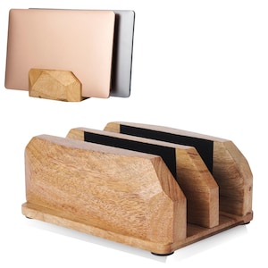 May include: A wooden laptop stand with three slots and a separate single laptop holder. The stand is made of light brown wood with black felt inserts in the slots. The single holder has a geometric design.
