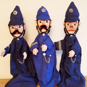 Policeman wooden carved hand puppet.