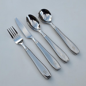 May include: A set of four silver-toned utensils, including a fork, knife, and two spoons. Each utensil has a unique design and a subtle engraved letter 'S' on the handle.