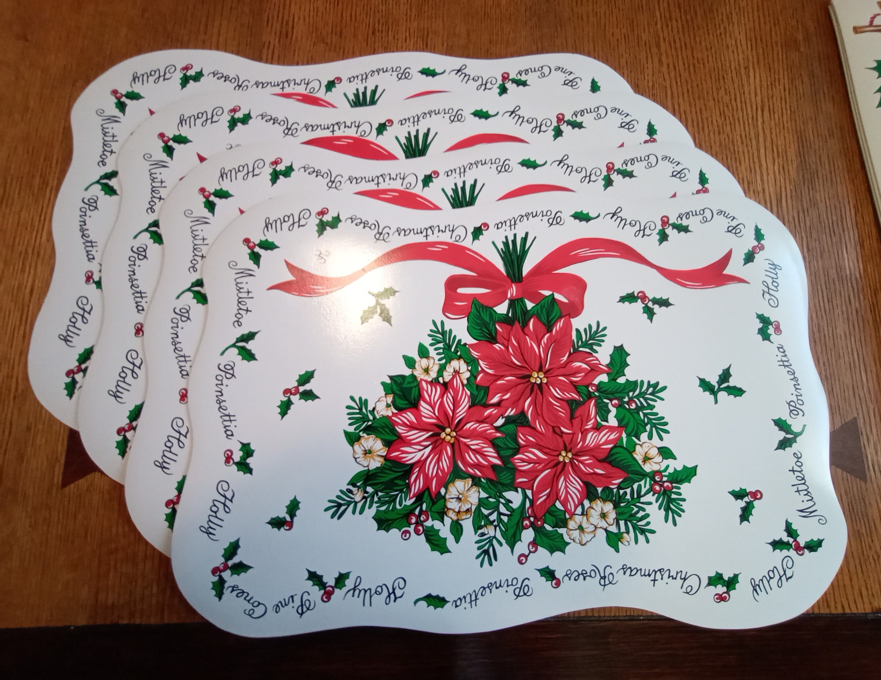 3 Sets of Washable Vinyl Holiday Placemats, Holly, Trumpets, Bells