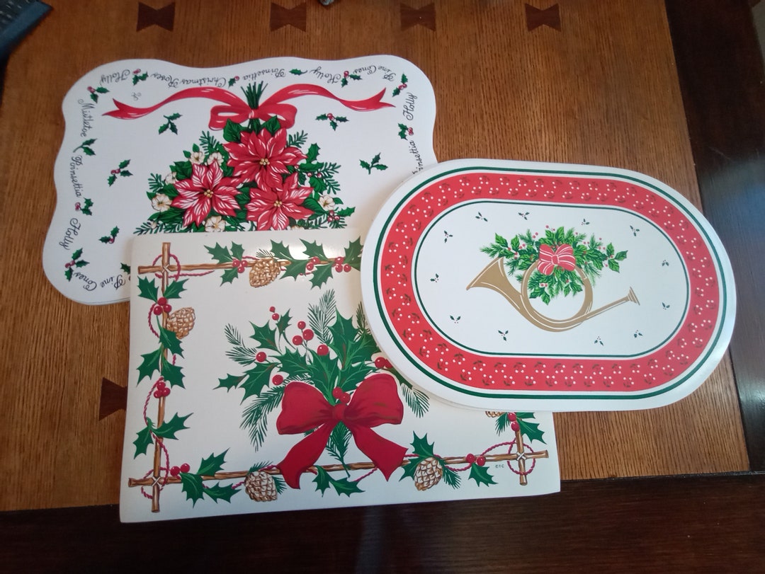 3 Sets of Washable Vinyl Holiday Placemats, Holly, Trumpets, Bells