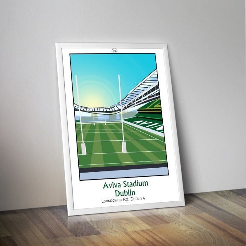 May include: A white framed illustration of Aviva Stadium in Dublin, Ireland. The stadium is shown with a green field and a blue sky. The text "Aviva Stadium Dublin Lansdowne Rd. Dublin 4" is printed below the image.