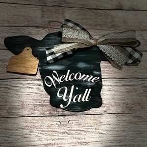 Cow door hanger