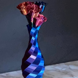 Color changing vase. Multicolored vase; Every side is a different variation of colors; Decorative vase