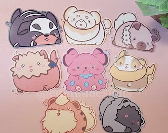 Puede incluir: Nueve pegatinas de animales de dibujos animados de colores con diferentes expresiones. Las pegatinas están sobre un fondo rosa. Los animales incluyen un perro blanco y negro, un perro marrón y blanco, una criatura rosa y azul, una criatura amarilla y blanca, una criatura marrón y blanca, una criatura blanca y marrón, una criatura marrón y blanca, una criatura gris y blanca y una criatura marrón y blanca.
