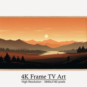 May include: A framed digital art print of a landscape scene with a lake, mountains, and trees. The sky is a warm orange color with a single white sun in the sky. The mountains are a dark brown color and the trees are a dark green color. The lake is a light blue color. The frame is a light brown wood.