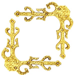 May include: Four gold metal corner brackets with a decorative, ornate design. The brackets have a hammered finish and are ideal for adding a touch of elegance to any project.