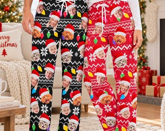 May include: Two pairs of pajama pants, one black and one red, featuring a repeating pattern of white snowflakes, colorful Christmas light bulbs, and custom photo faces of people and pets wearing Santa hats, with white drawstring waistbands.