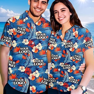 May include: Two short-sleeved button-down shirts with a tropical floral pattern. The shirts are blue with white, orange, and green floral and leaf designs. The text "YOUR LOGO" is printed on the shirts.
